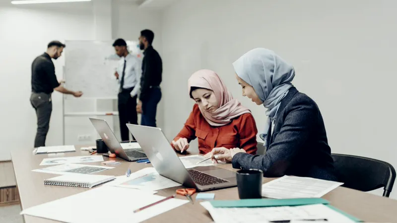 A project team working through headcount and schedules in an office, standing for construction and fit out companies in the UAE